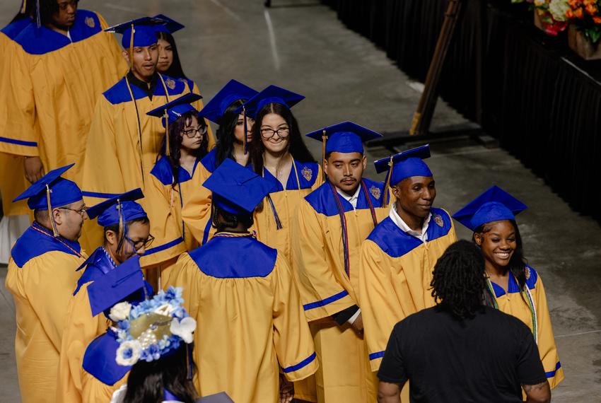 David Avila walks towards the stage to receive his diploma at his high school graduation ceremony at Delmar High School, Friday, June 6, 2025, in Houston.(Lexi Parra for The Texas Tribune)